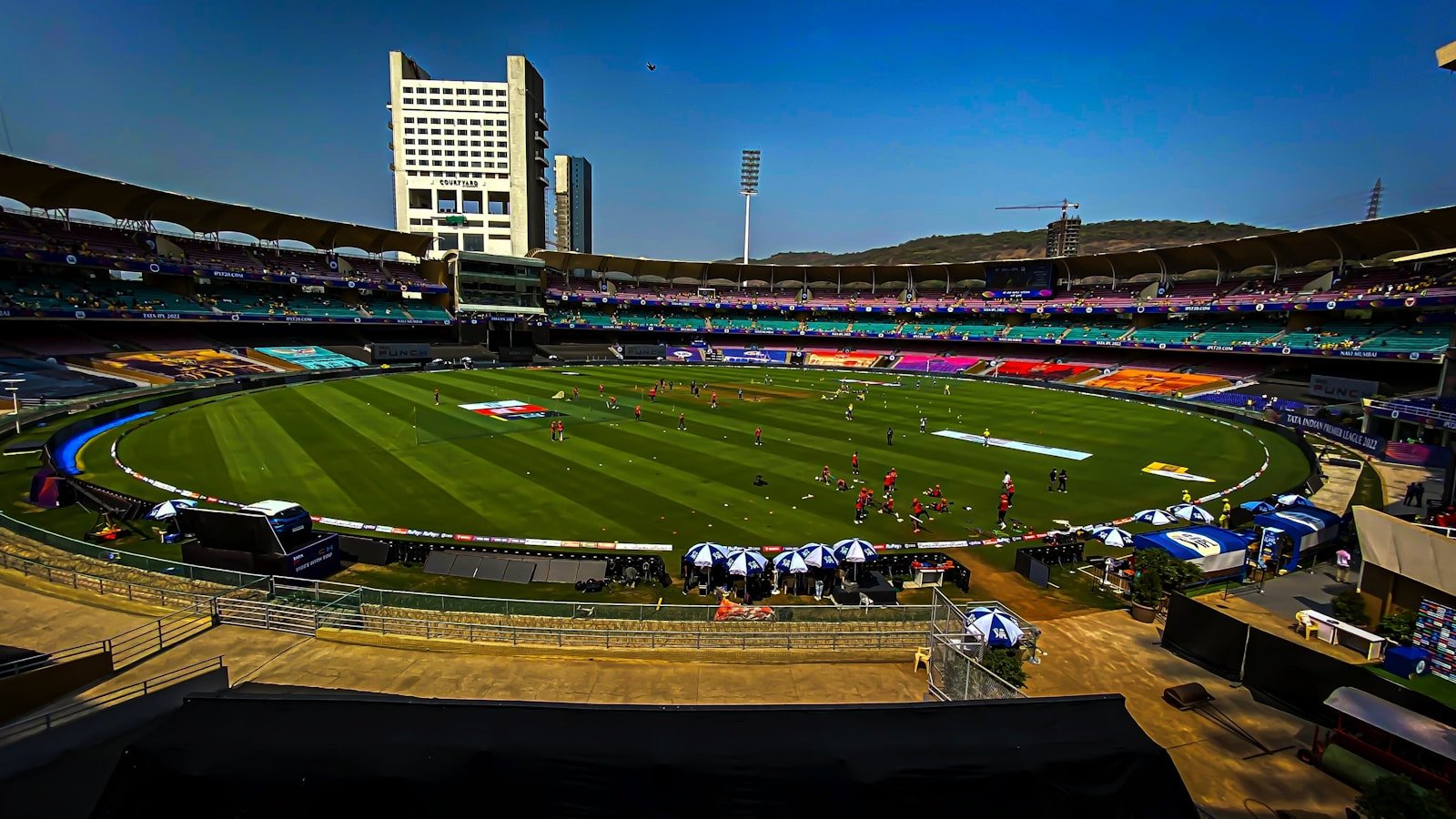 a sports field with a crowd of people in the stands
