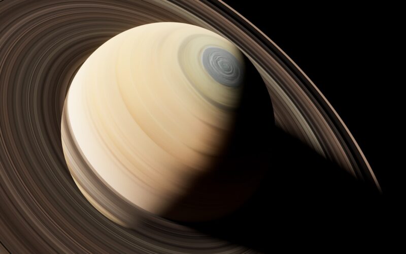a close up of a saturn planet with a black background