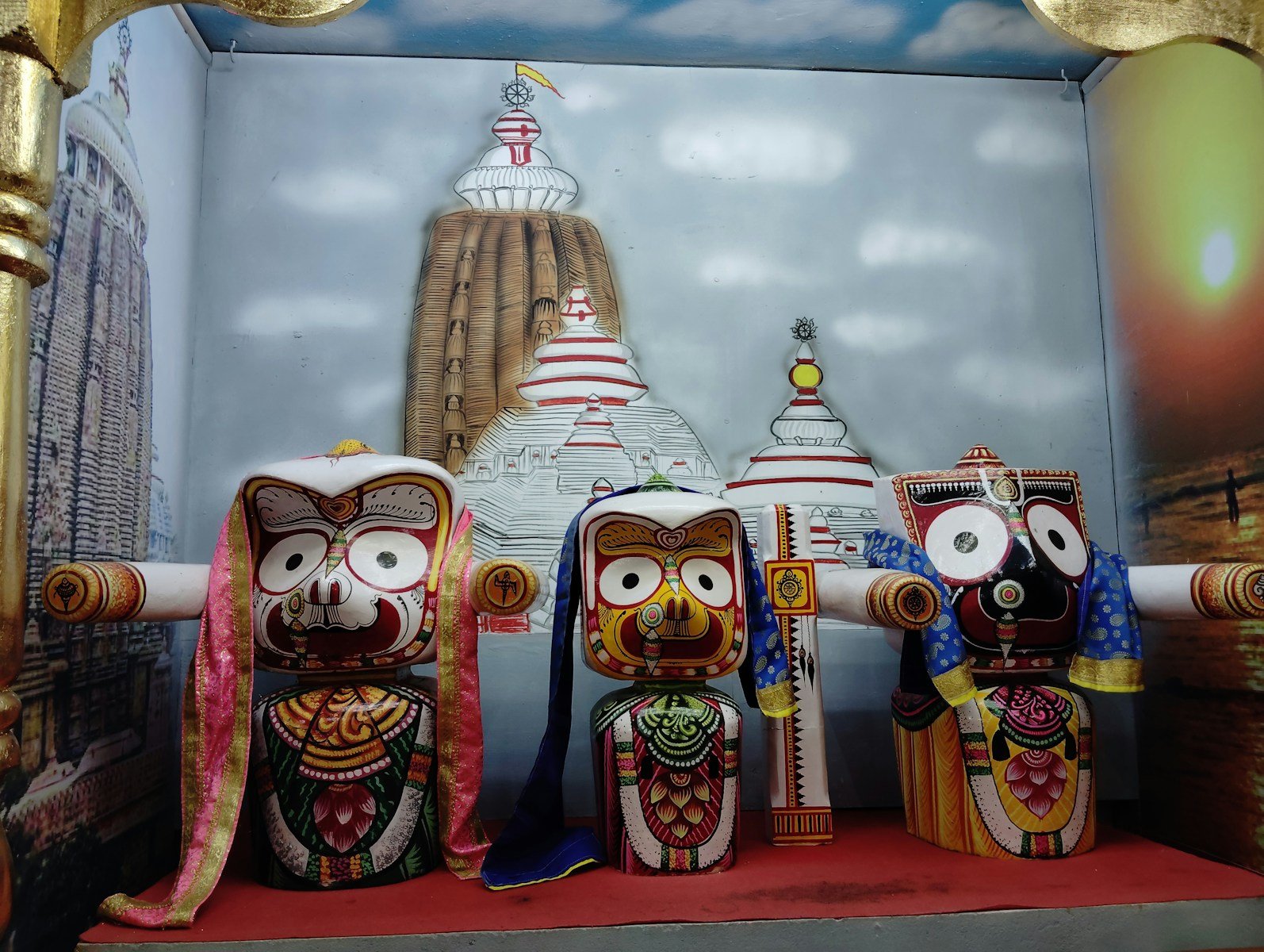 A group of owls sitting on top of a red carpet