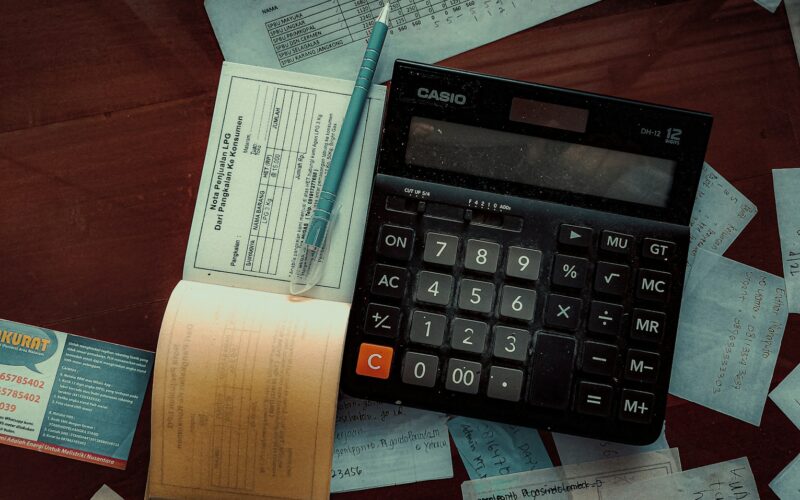 a calculator sitting on top of a wooden table