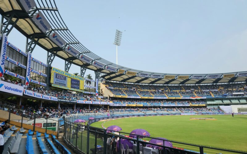 A cricket stadium filled with lots of people