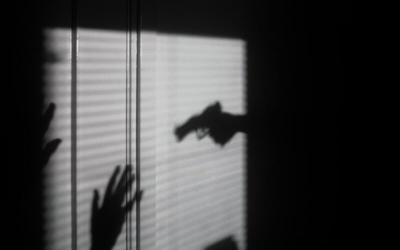 silhouette of person on window