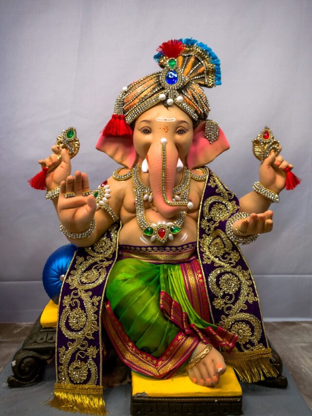 woman in gold and red sari dress