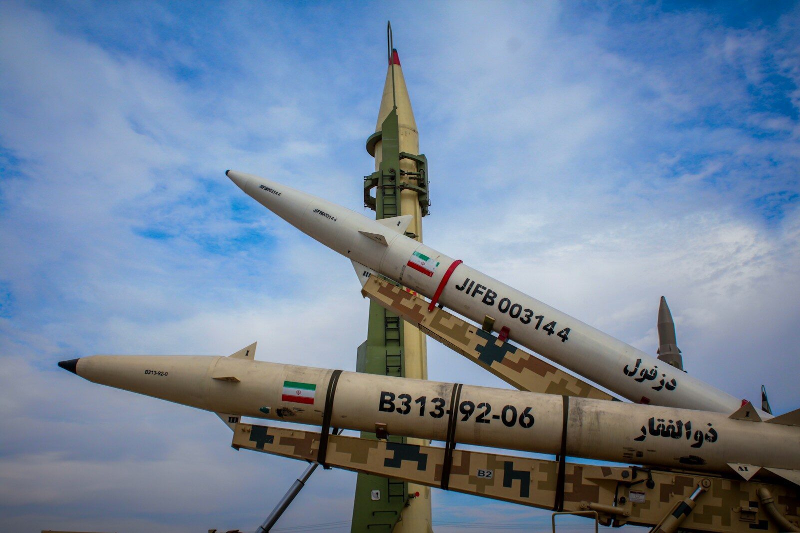 A group of fighter jets sitting on top of each other