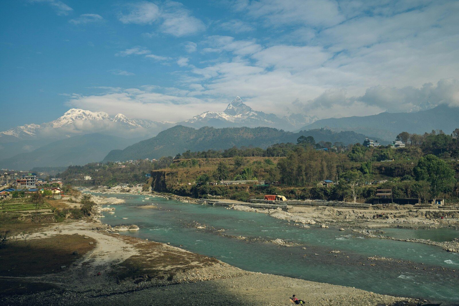 a river with a mountain in the background