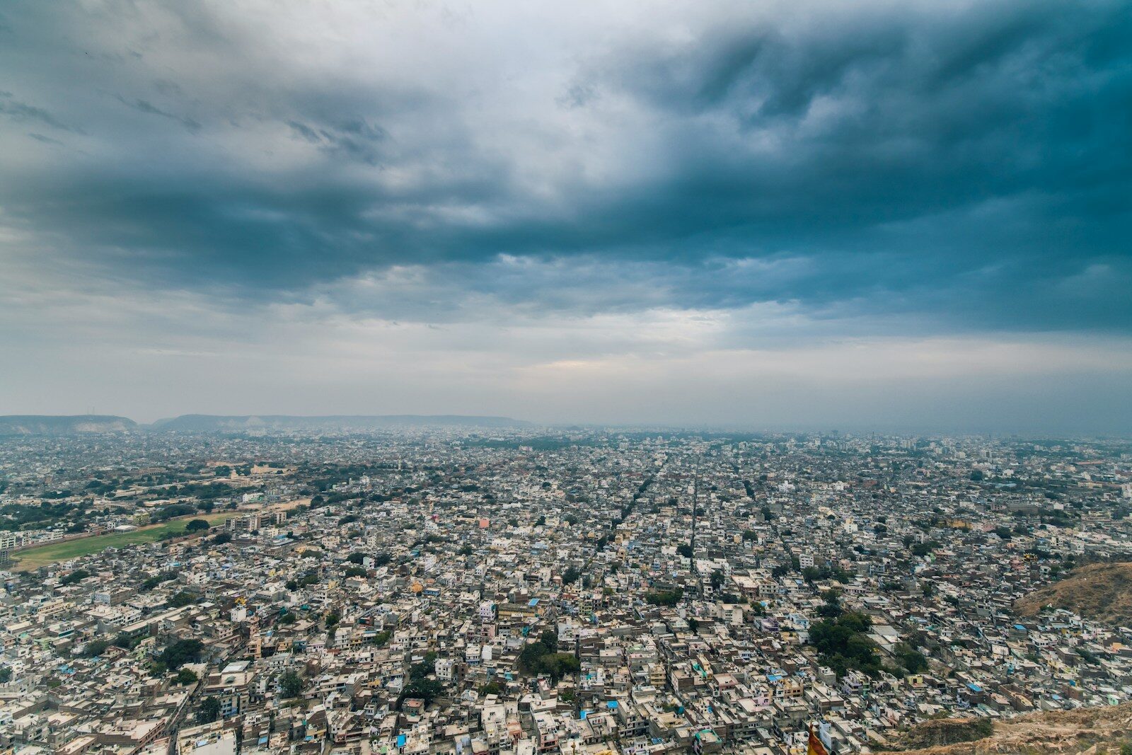aerial photography of a city over dramatic sky