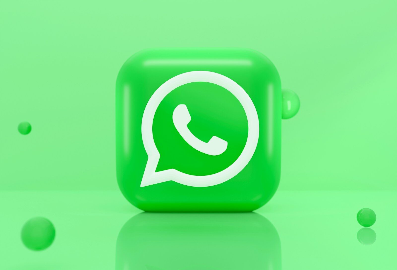 A green 3D icon of a telephone handset inside a speech bubble