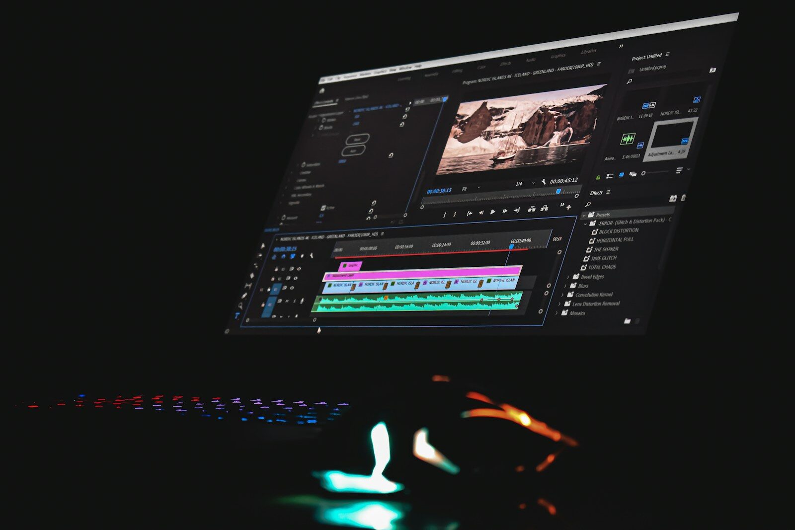 A computer monitor displaying video editing software with a timeline and preview window