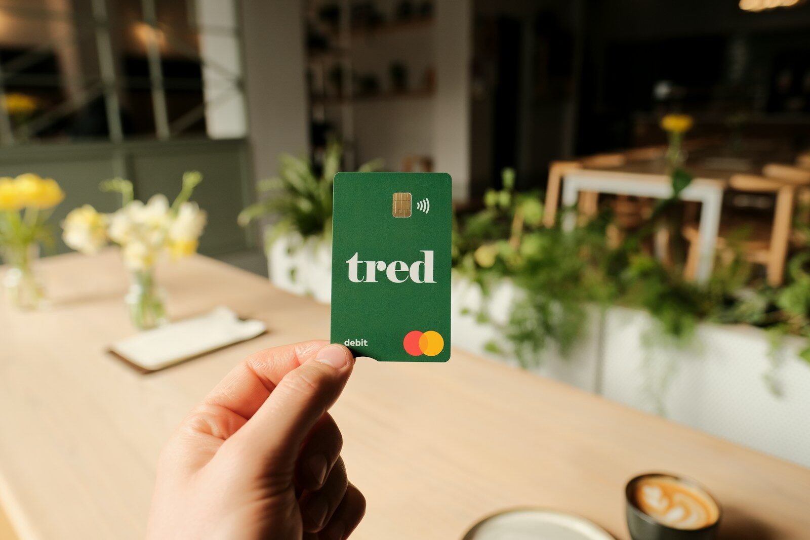 a person holding up a card with the word tired on it