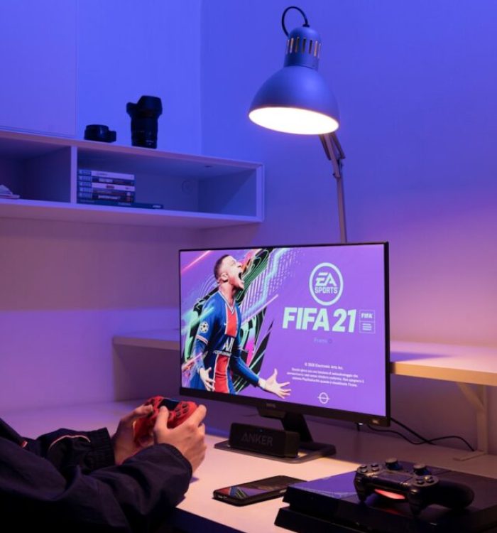 black flat screen tv turned on near black remote control