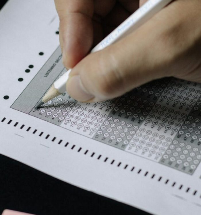 person writing on white paper